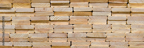 Wood texture.Stack of wood planks on lumber yard. lumber industrial wood texture timber.