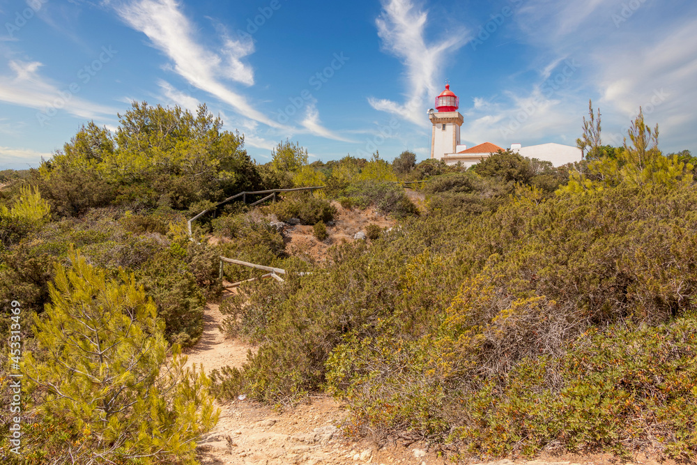 Beautiful Alfanzina Lighthouse in the coastal area of Carvoeiro, Algarve - Portugal Beautiful Alfanzina Lighthouse in the coastal area of Carvoeiro, Algarve - Portugal