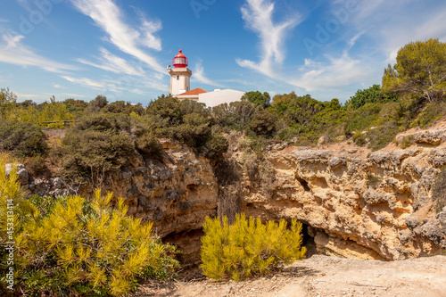 Beautiful Alfanzina Lighthouse in the coastal area of Carvoeiro, Algarve - Portugal