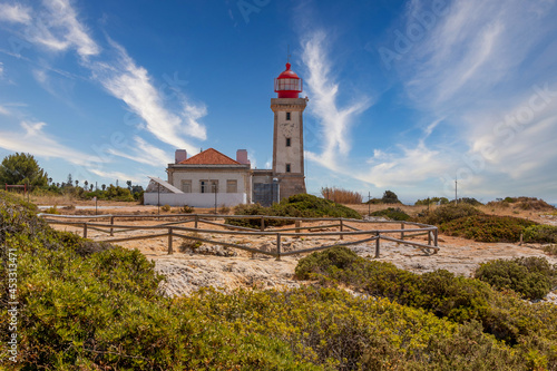 Beautiful Alfanzina Lighthouse in the coastal area of Carvoeiro, Algarve - Portugal © WildGlass Photograph