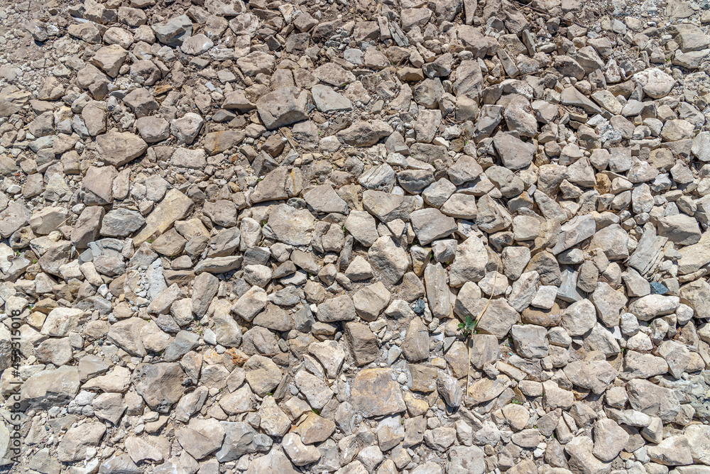 The texture of stones, crushed stone lying on the ground The texture of stones, crushed stone lying on the ground