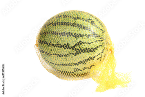 watermelon in a string bag isolated on white background
