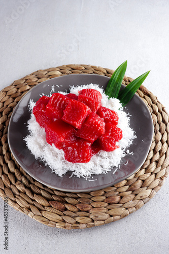 Ongol ongol ubi merah putih or red and white sweet potato cake. Indonesia traditional cake that made for celebrete independence day. It's steamed and wraped with grated coconut after cooked. photo