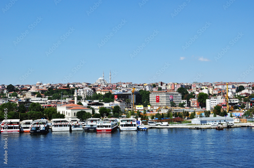 Panorama of Istanbul. View of the strait, mosque and ships at the pier. 09 July 2021, Istanbul, Turkey.
