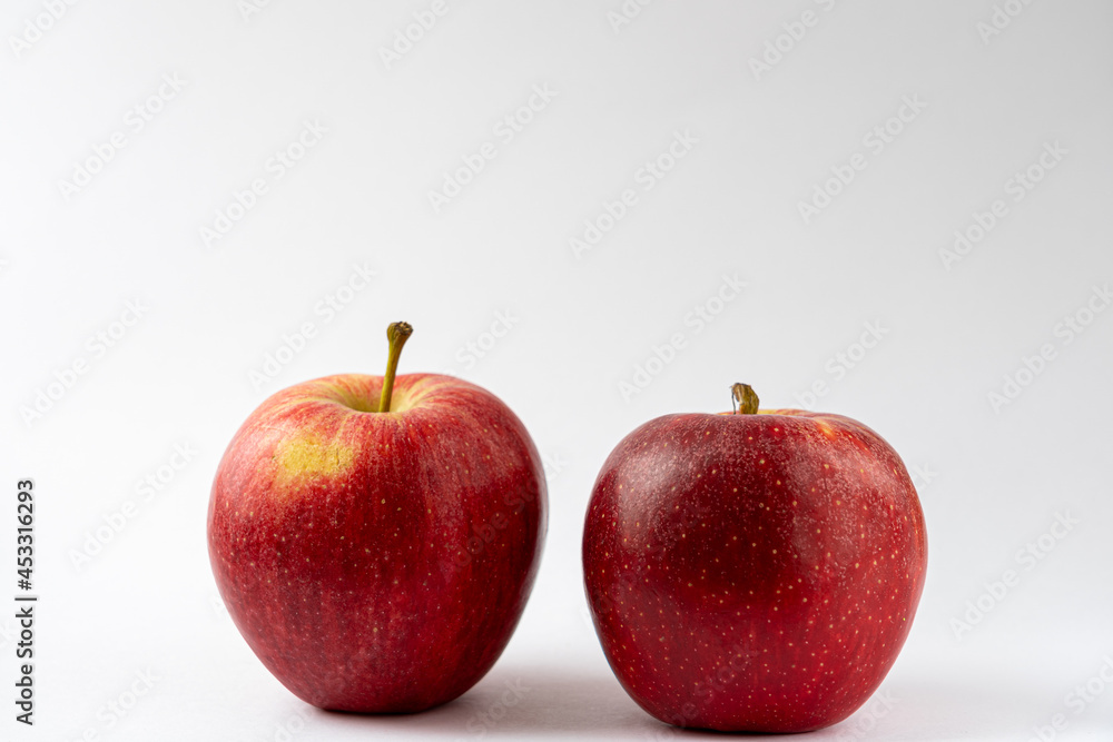 Two red apples against a white background. Royal gala apples. Food product photography Two red apples against a white background. Royal gala apples. Food product photography