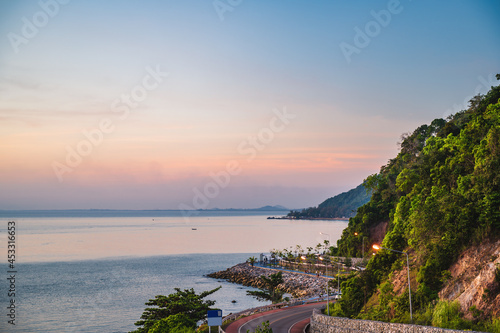 Beautiful seascape view with the mountain and sunset at noen nangphaya viewpoint chanthaburi thailand. photo