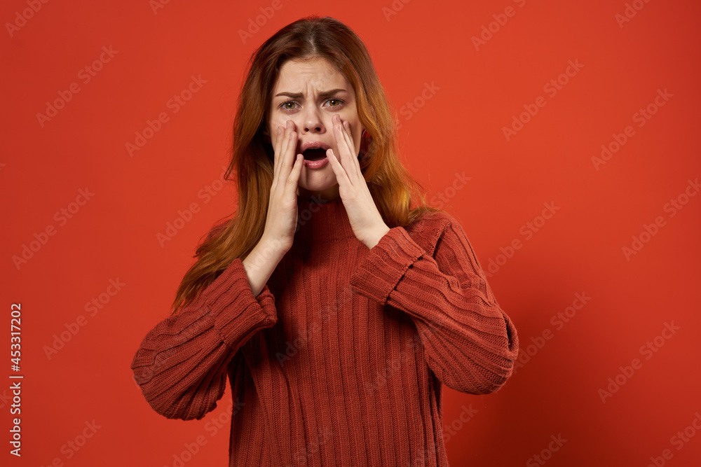 woman in red sweater earrings jewelry red background gesture with hands woman in red sweater earrings jewelry red background gesture with hands
