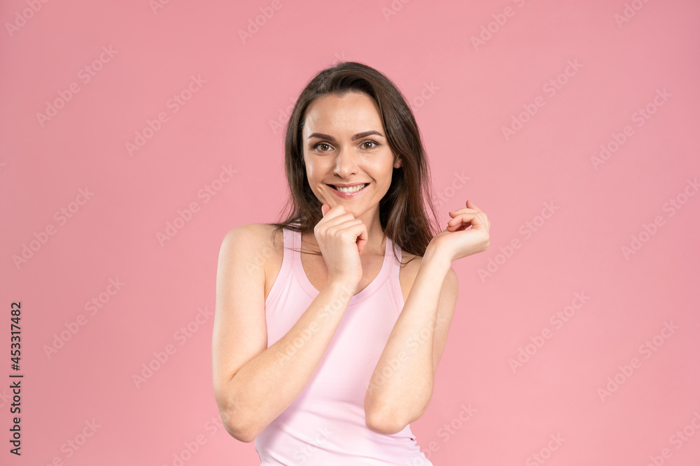 Tender beautiful girl with no makeup, skin care concept, attractive brunette girl on pink background. Human emotions, facial expression concept. Beauty concept. Tender beautiful girl with no makeup, skin care concept, attractive brunette girl on pink background. Human emotions, facial expression concept. Beauty concept.