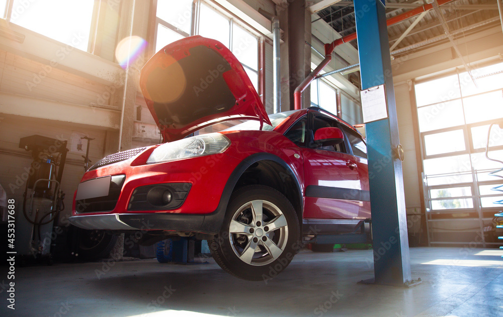 Modern car repair station with a large number of lifts and specialized equipment for diagnostics and service repair car Modern car repair station with a large number of lifts and specialized equipment for diagnostics and service repair car