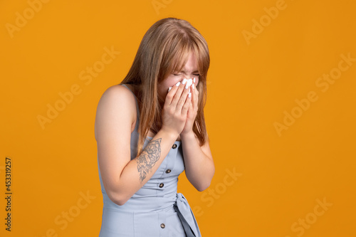 Portrait of young Caucasian young girl in casual clothes isolated on yellow color studio background. Concept of human emotions, facial expression, youth, feelings, ad.