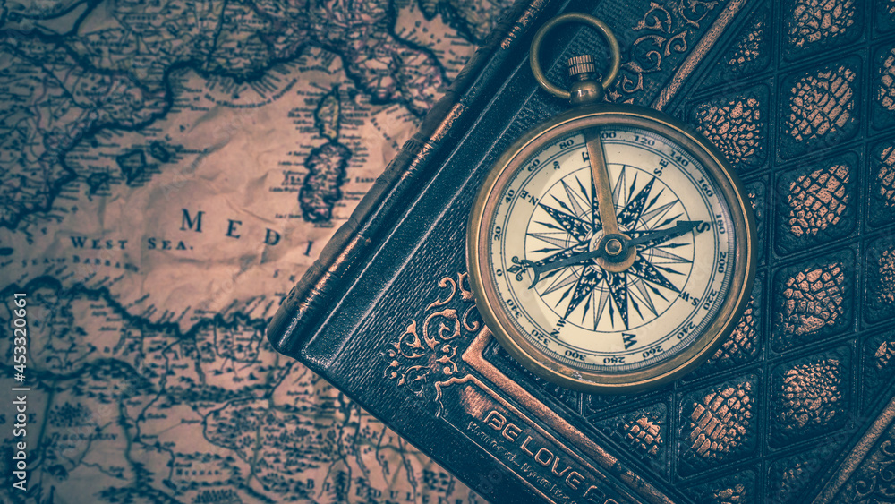 Compass On Old Book And Map