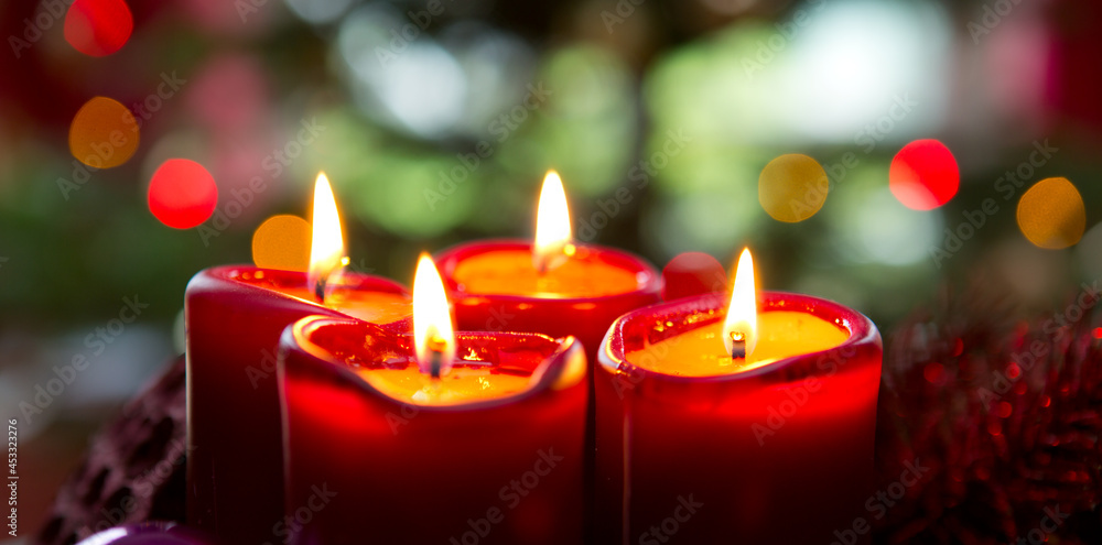 Four red candles for Advent. Christmas background. Four red candles for Advent. Christmas background.