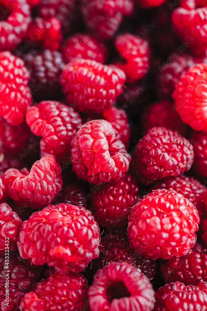 Fresh ripe raspberries, close-up. Berry colorful background Fresh ripe raspberries, close-up. Berry colorful background
