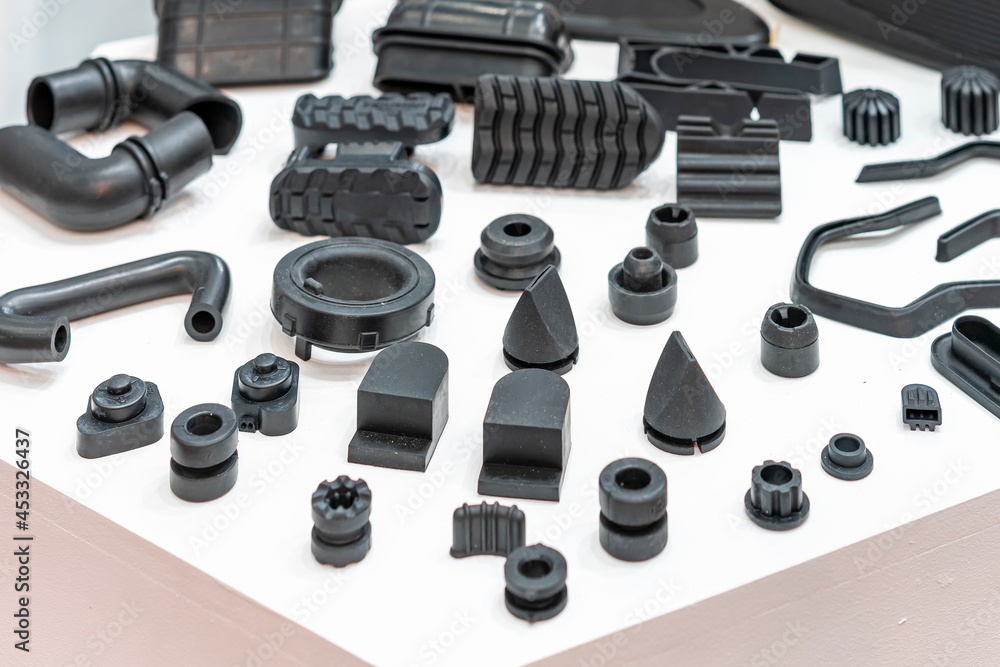 Various compression molded rubber sample parts made from manufacturing process in industrial e.g. plug cover cap pipe tube pedal nozzle connector and automobile parts other - obrazy, fototapety, plakaty 