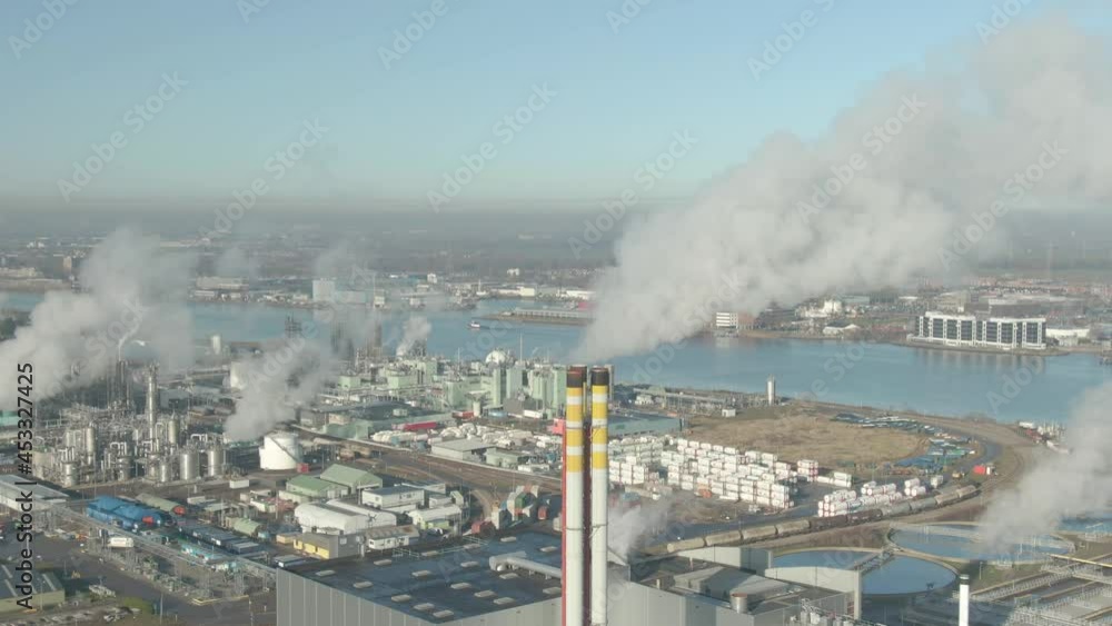 Aerial view of Industrial chimney emissing smoke Aerial view of Industrial chimney emissing smoke