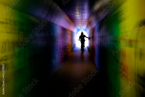 Riding Bike Bicycle in Tunnel with Graffiti Innercity Zoom Effect Motion © Lane Erickson