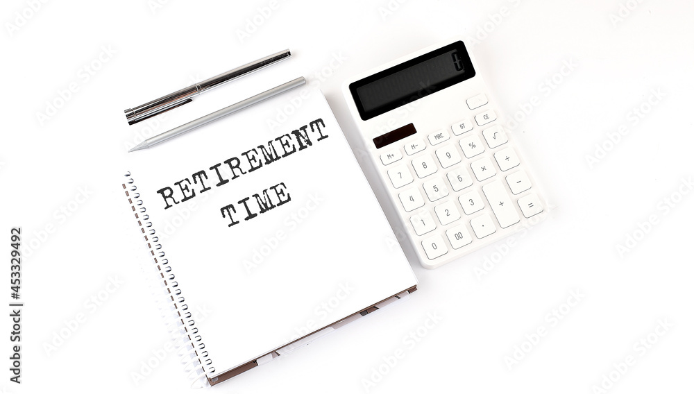 Notepad with text RETIREMENT PLAN with calculator and pen. White background. Business concept Notepad with text RETIREMENT PLAN with calculator and pen. White background. Business concept