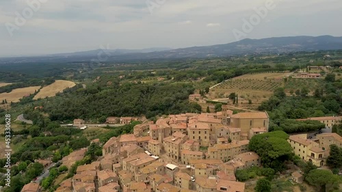 Wallpaper Mural Aerial drone view on the medieval Tuscany old town on the countryside Casale Marittimo with cypress trees and fields during a cloudy day, Pisa province, Italy Torontodigital.ca