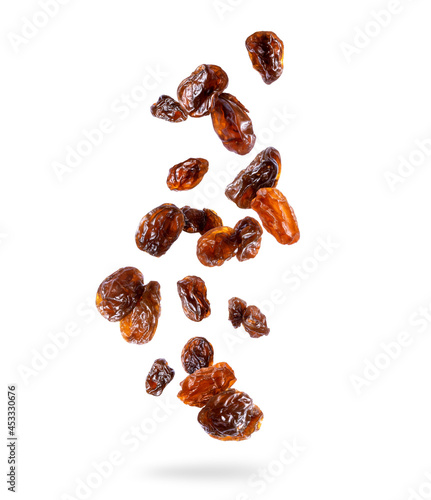 Delicious raisin in the air isolated on white background photo