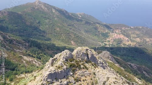 Aerial Drone video of mountain landscape around Monte Campanne highest mountain on Isola d'Elba on a sunny summer day, Italy photo