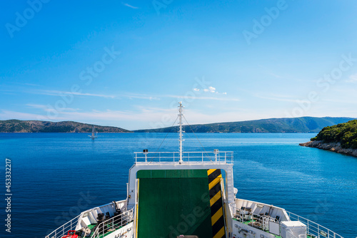 view from the upper deck of the Jadrolinija ferry to the sea and the island of Cres - the bow of the ship in the foreground photo