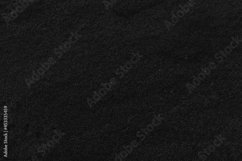 Dark grey black slate background or texture. Black granite slabs background.