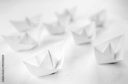 White paper boats or Origami boats on white background.