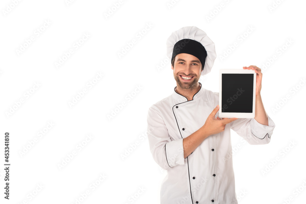 Smiling chef holding digital tablet with blank screen isolated on white