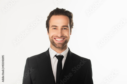 Smiling businessman looking at camera isolated on white