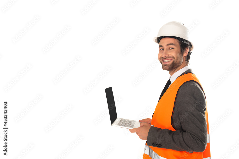 Engineer in safety vest holding laptop isolated on white Engineer in safety vest holding laptop isolated on white