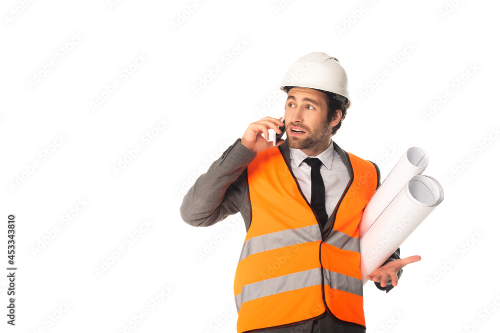 Engineer with blueprints talking on smartphone isolated on white Engineer with blueprints talking on smartphone isolated on white