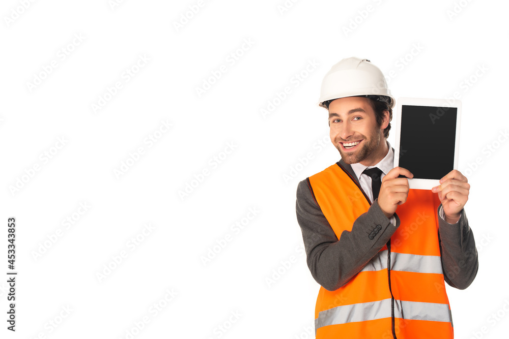 Positive engineer showing digital tablet and looking at camera isolated on white Positive engineer showing digital tablet and looking at camera isolated on white