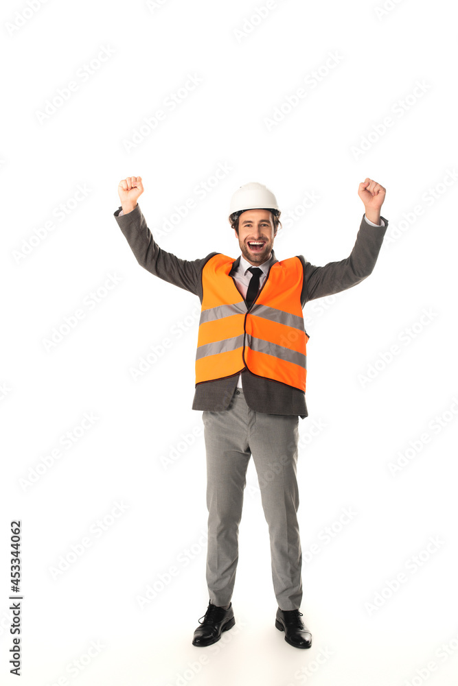 Excited engineer in safety vest showing yes gesture on white background Excited engineer in safety vest showing yes gesture on white background