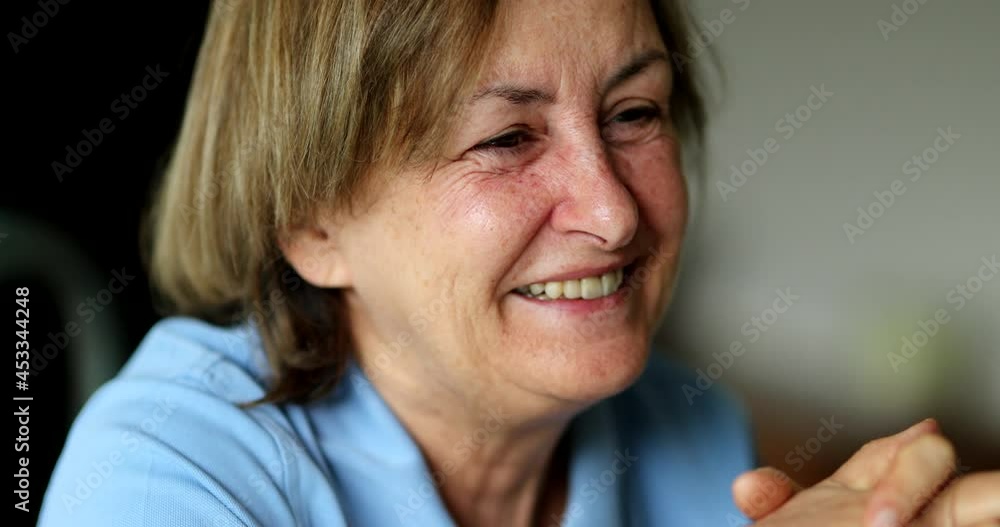 Older woman candid smile. Authentic real life natural smiling expression, senior person Older woman candid smile. Authentic real life natural smiling expression, senior person