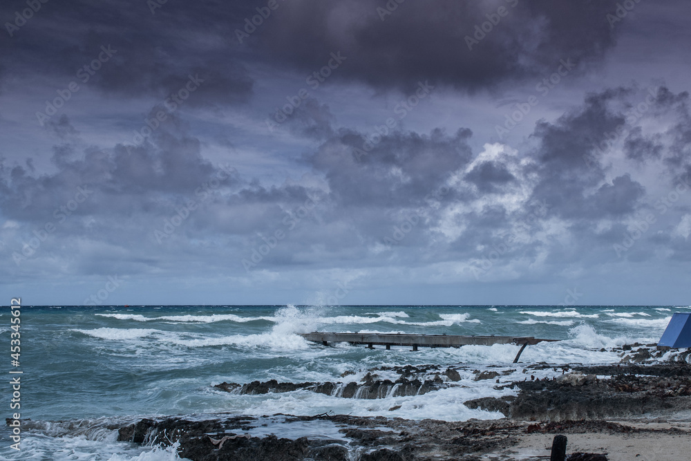 Waves from tropical storm Ida as it blows through the Cayman Islands pummel the dock in West Bay Waves from tropical storm Ida as it blows through the Cayman Islands pummel the dock in West Bay