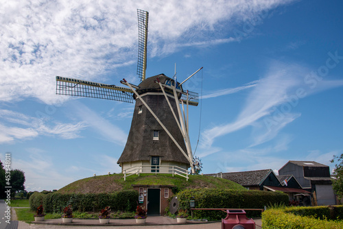 Old windmill with blue sky background