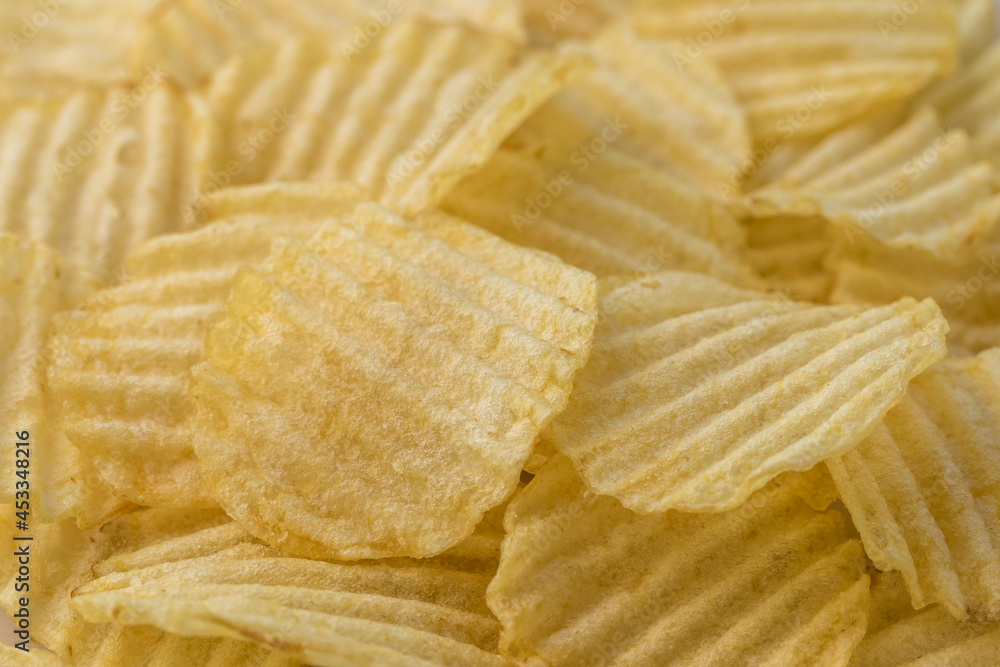 Potato chips close up. Organic food. Food background. Macro Potato chips close up. Organic food. Food background. Macro