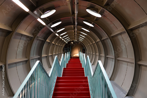 red stairs down the tunnel