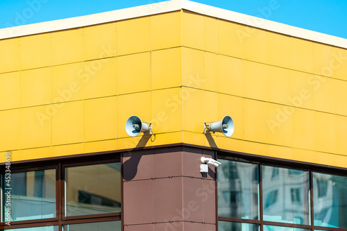 Canvas Print Loudspeakers and video cameras on the school building