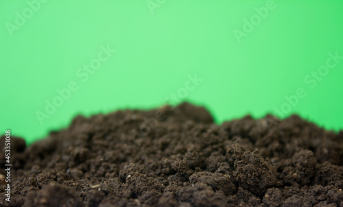 bio ground or soil substrate as frame or border isolated on green background. Place for text, copy space