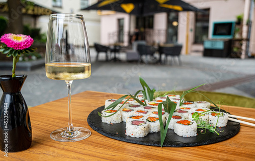 sushi and white wine in restaurant