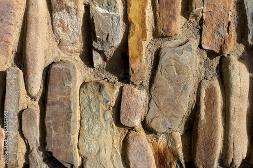 Stone wall backgrounds for working design, various solutions and structures, top angle, close-up. photo