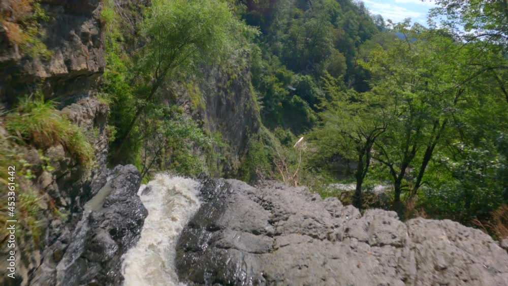 Fast extreme dive flight over epic natural mountain river drops stream at jungle exotic rainforest aerial view. Fpv sport drone speed movement nature waterfall at vegetation greenery wild environment Fast extreme dive flight over epic natural mountain river drops stream at jungle exotic rainforest aerial view. Fpv sport drone speed movement nature waterfall at vegetation greenery wild environment