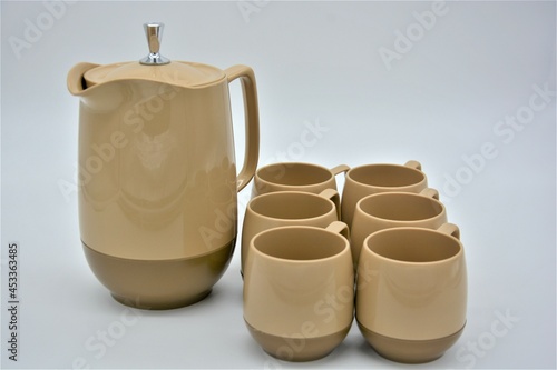 Vintage plastic pitcher and mugs