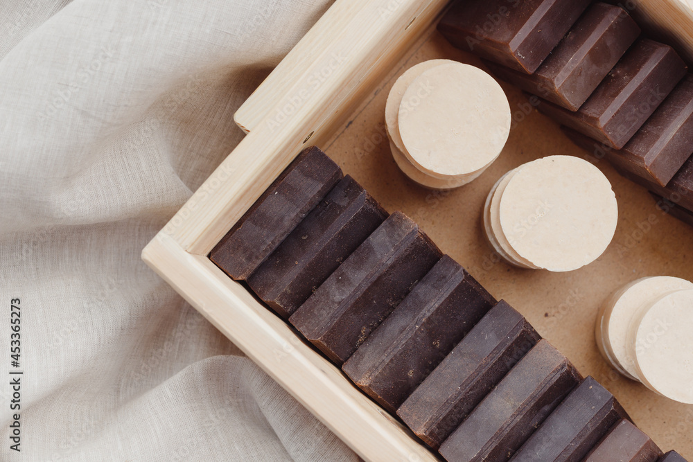 Handmade soap bars batch in wooden box. Deep brown color men solid soaps Handmade soap bars batch in wooden box. Deep brown color men solid soaps