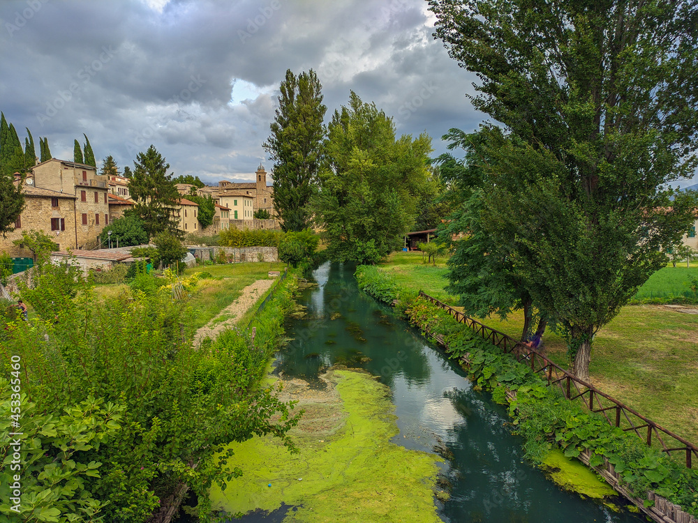 View of clear river in the medieval center of Bevagna little town in the green umbria, Italy