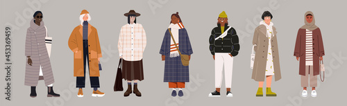 Set of fashionable female characters in trendy clothes on grey background. Classy colorful street style outfits for women. Winter, spring and autumn clothes. Flat cartoon vector illustration