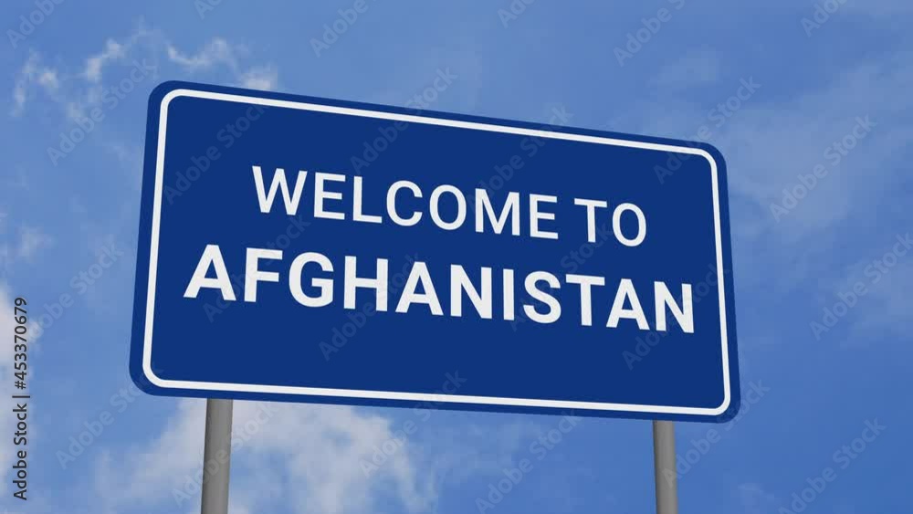 Welcome to Afghanistan Road Sign on Clear Blue Sky with Rapid Moving Clouds Welcome to Afghanistan Road Sign on Clear Blue Sky with Rapid Moving Clouds