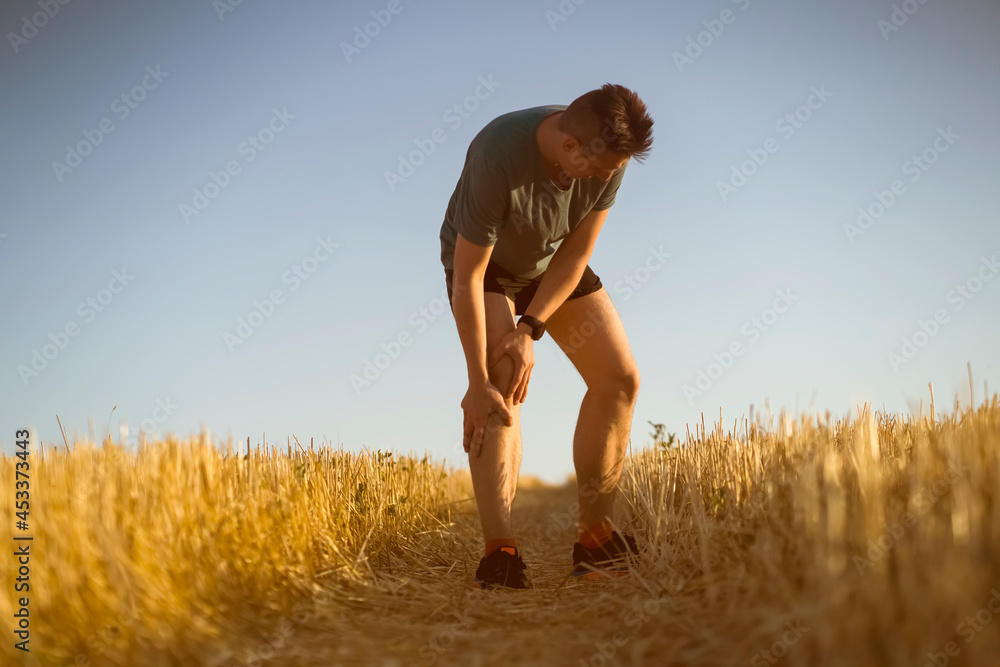 A young man jogging at sunset. A young man jogging at sunset.