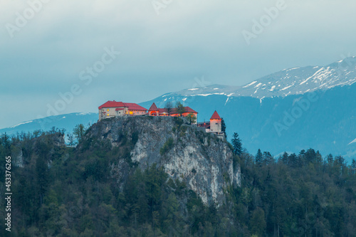 Lake Bled in the middle of the island with the church and the castle at sunset in the Triglav National Park in the Julian Alps